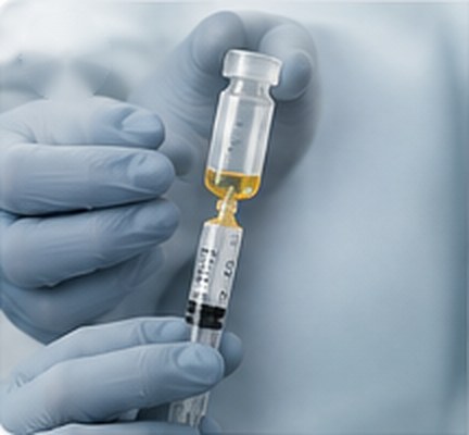Syringe being filled from a vial